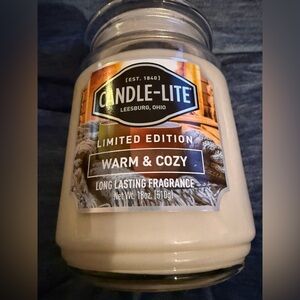Candle-lite 18 ounce candle “Warm and Cozy” NEW UNUSED Burn time 70-110 hours